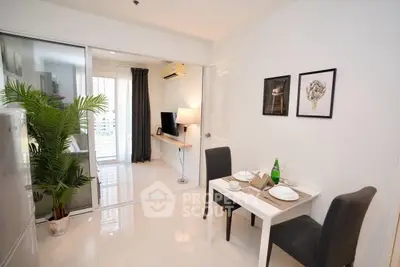 Modern apartment dining area with sleek decor and natural light