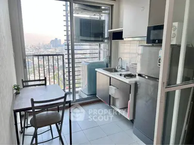 Modern kitchen with balcony view in high-rise apartment