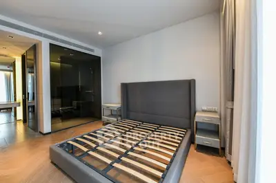 Spacious modern bedroom with sleek design and ample natural light