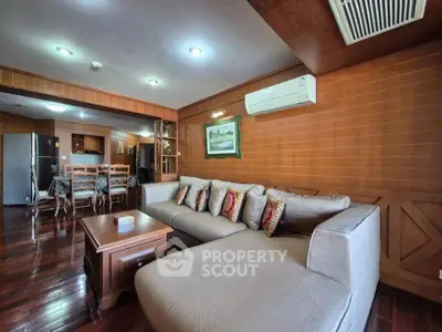 Spacious living room with wooden accents and modern furniture in a cozy home.
