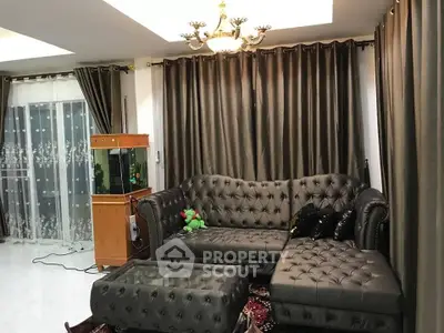 Luxurious living room with elegant leather sofa and chandelier lighting