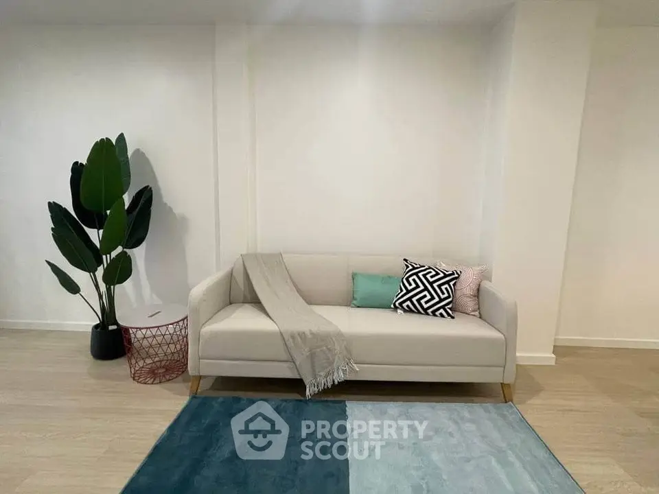 Modern minimalist living room with stylish sofa and decor