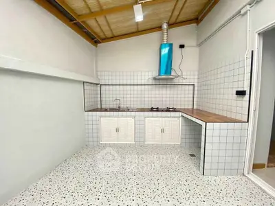 Modern kitchen with tiled backsplash and gas stove in open layout