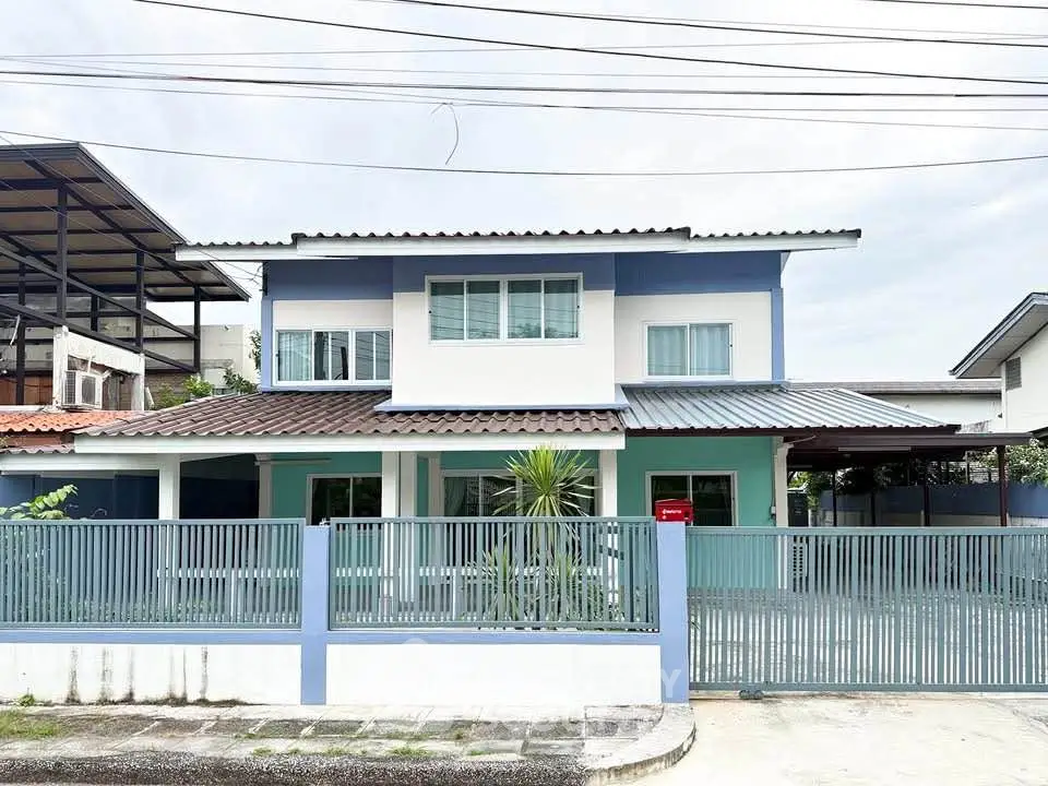Charming two-story house with modern design and gated front yard