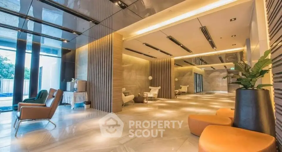 Luxurious modern lobby with elegant seating and ambient lighting in a high-end building.