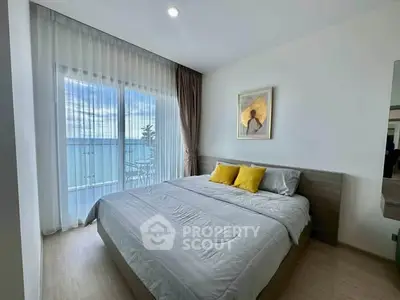 Modern bedroom with ocean view and stylish decor
