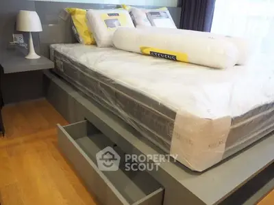 Modern bedroom with sleek bed and built-in storage drawers