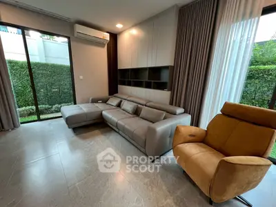 Modern living room with sleek furniture and garden view