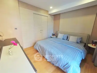 Spacious bedroom with modern decor and cozy ambiance
