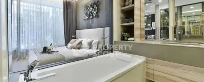 Luxurious modern bedroom with ensuite bathroom featuring a sleek bathtub and elegant decor.