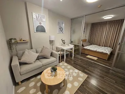 Modern studio apartment with cozy living area and stylish bedroom