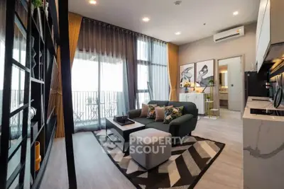 Modern living room with stylish decor and balcony view in a contemporary apartment.