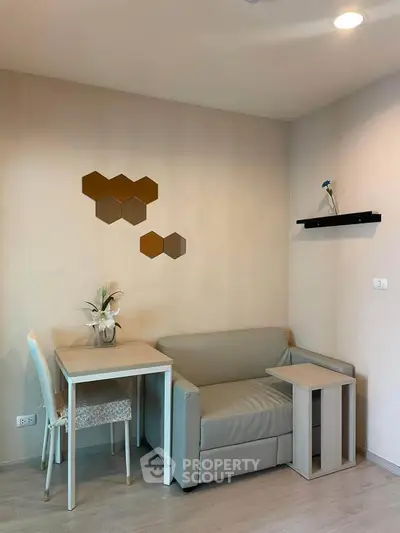 Cozy living room with modern decor and compact furniture setup