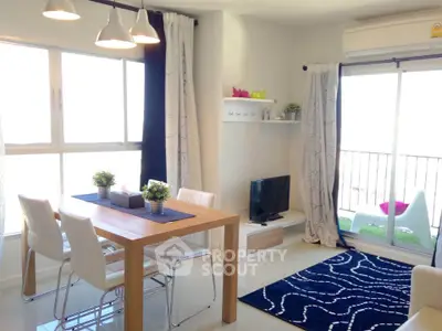 Bright modern living room with dining area and balcony access