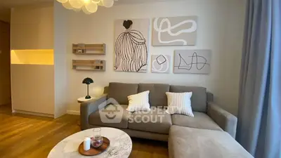 Stylish living room with modern art, cozy sofa, and elegant decor