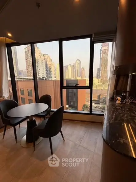 Modern apartment with stunning city view and elegant dining area