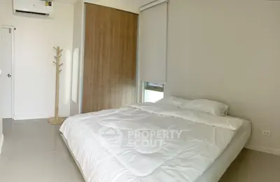 Minimalist bedroom with cozy bed and modern decor
