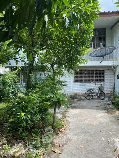 Charming residential property with lush garden and spacious outdoor area, perfect for relaxation and outdoor activities.