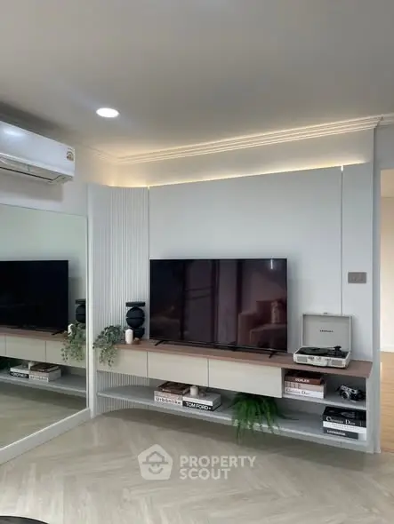 Modern living room with sleek TV setup and stylish decor