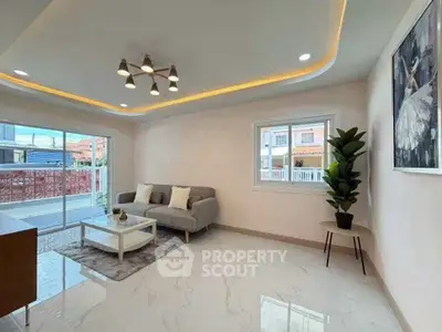 Modern living room with elegant lighting and large window view