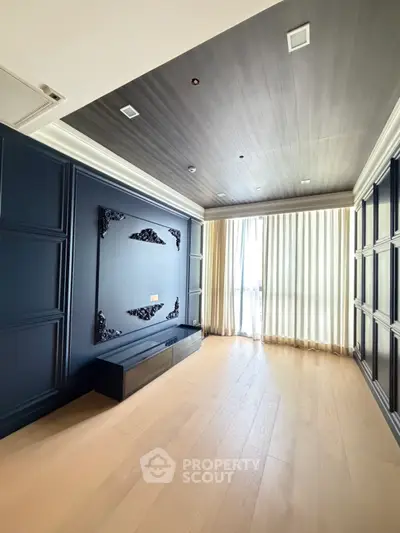 Elegant modern living room with stylish dark paneling and large window