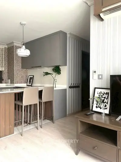 Modern open-layout kitchen with stylish bar seating and contemporary decor