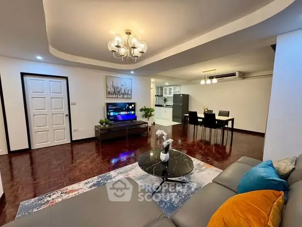 Spacious modern living room with open kitchen and elegant decor