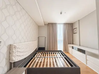 Spacious bedroom with modern design and ample natural light