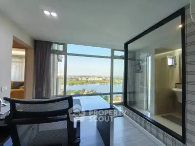 Modern apartment with stunning river view and glass-walled bathroom
