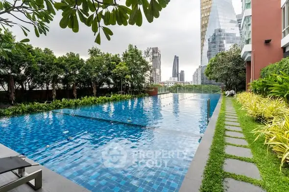 Luxurious urban swimming pool with city skyline view and lush greenery.