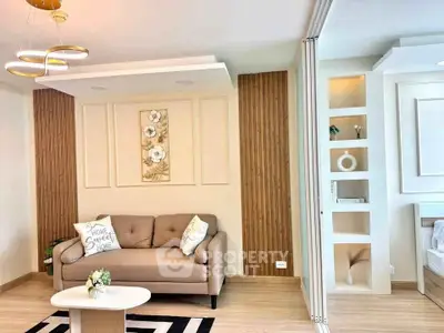 Stylish modern living room with elegant decor and cozy seating in a contemporary apartment.