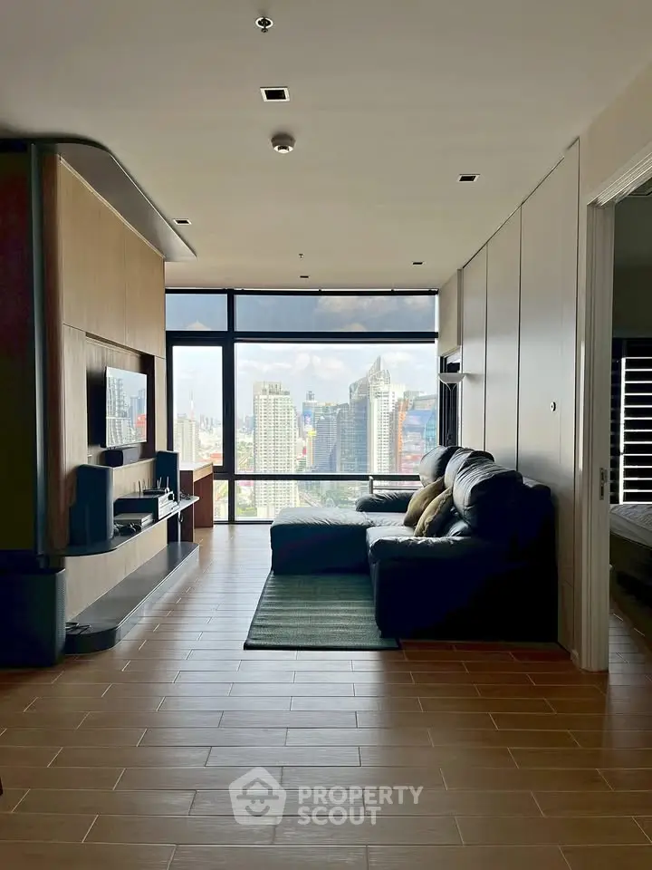 Spacious living room with stunning city view and modern furnishings