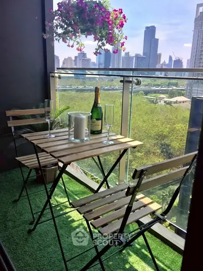 Charming balcony with city view, perfect for relaxation and enjoying a glass of wine.