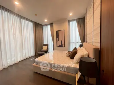Luxurious modern bedroom with elegant decor and floor-to-ceiling windows