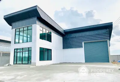 Modern industrial warehouse with large windows and spacious exterior