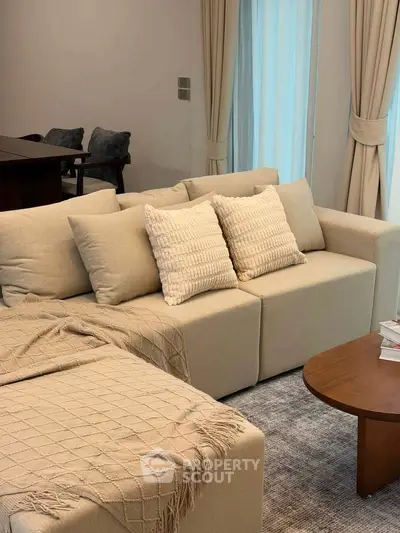Elegant living room with cozy beige sofa and stylish decor