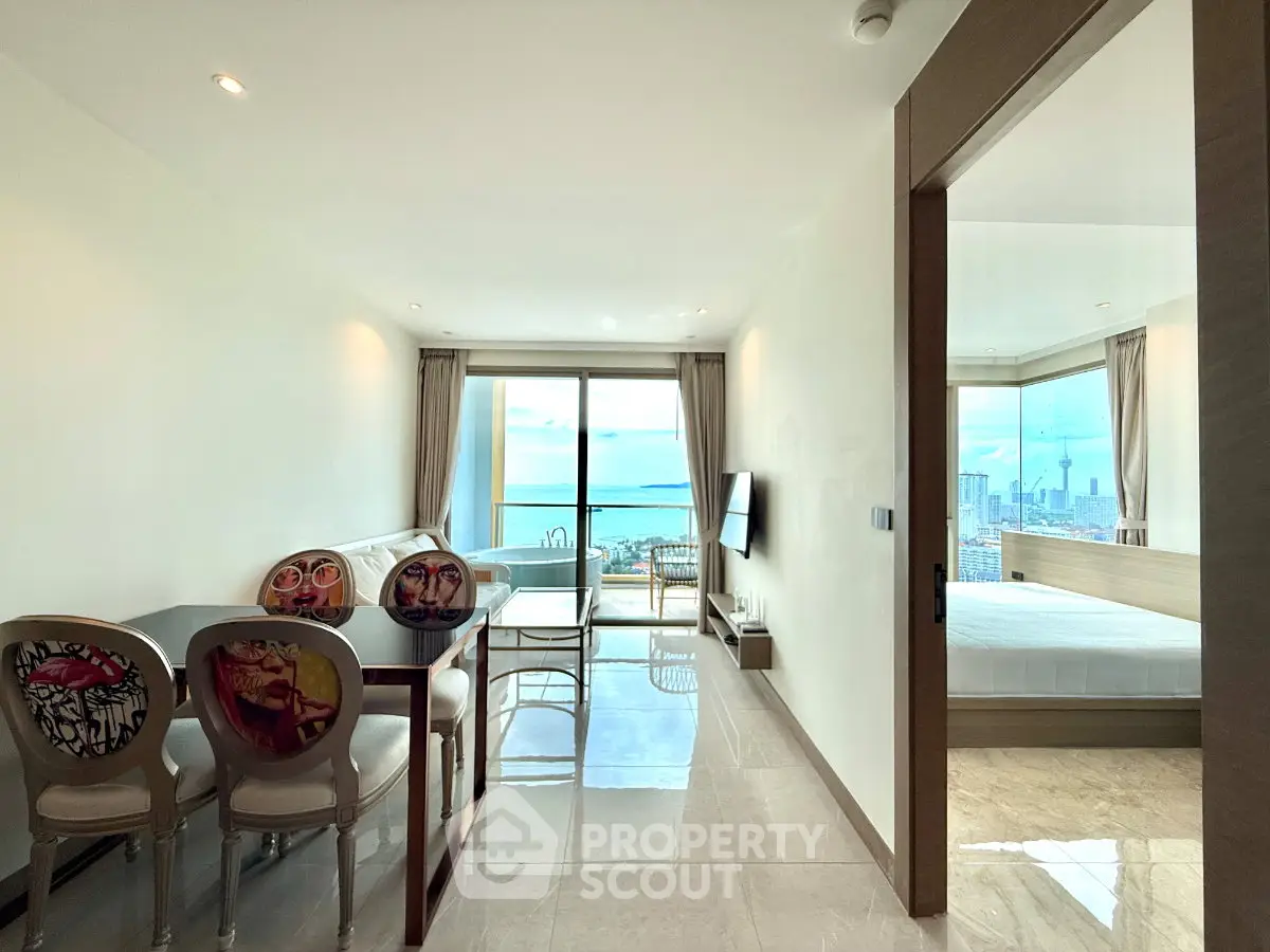 Modern apartment with stunning city view, open living area, and stylish decor.