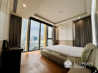 Luxurious bedroom with panoramic city view and modern furnishings