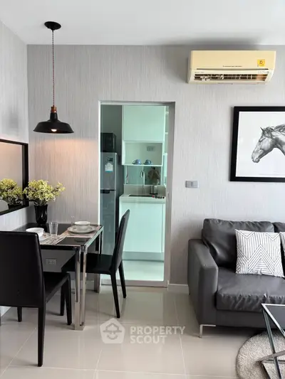 Modern living room with sleek dining area and stylish decor