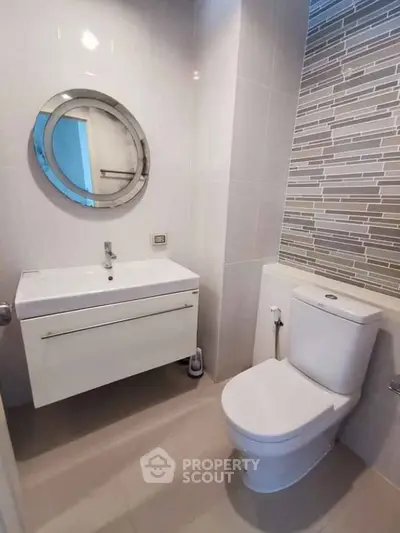 Modern bathroom with sleek vanity and stylish tile accents