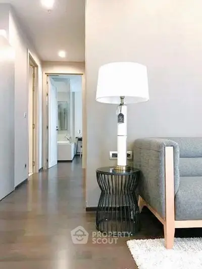 Modern living room with stylish furniture and elegant lighting in a contemporary apartment.