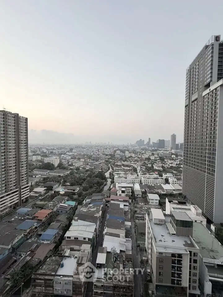 Stunning cityscape view from high-rise building showcasing urban skyline and architectural diversity.