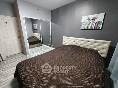 Modern bedroom with mirrored closet and stylish decor