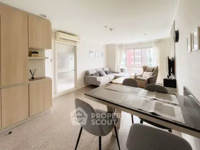 Spacious modern living room with dining area and large windows