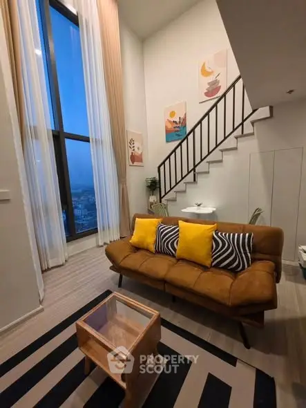 Modern loft living room with high ceilings and stylish decor