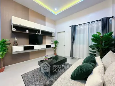 Modern living room with stylish decor, floating shelves, and cozy seating area.