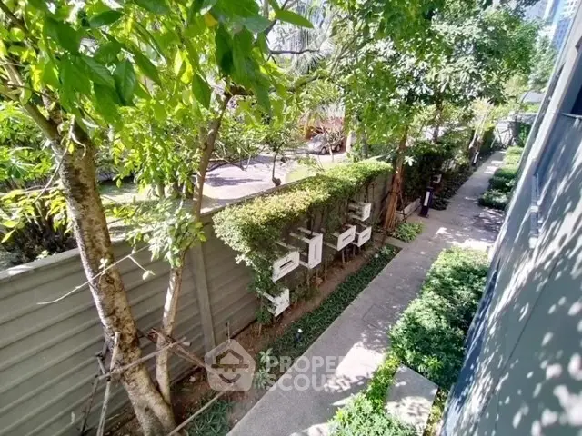 Lush garden view with pathway in modern residential complex