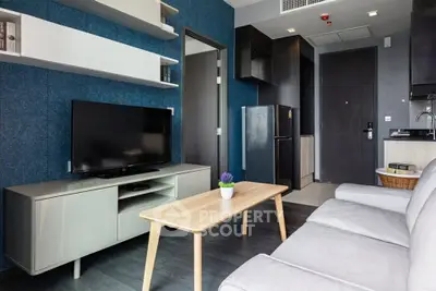 Modern living room with sleek furniture and stylish decor in a contemporary apartment.