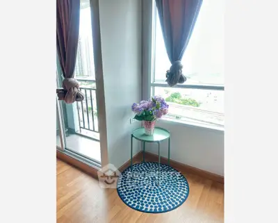 Charming corner with balcony view and elegant decor in modern apartment.