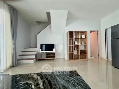 Modern living room with sleek staircase and stylish shelving unit